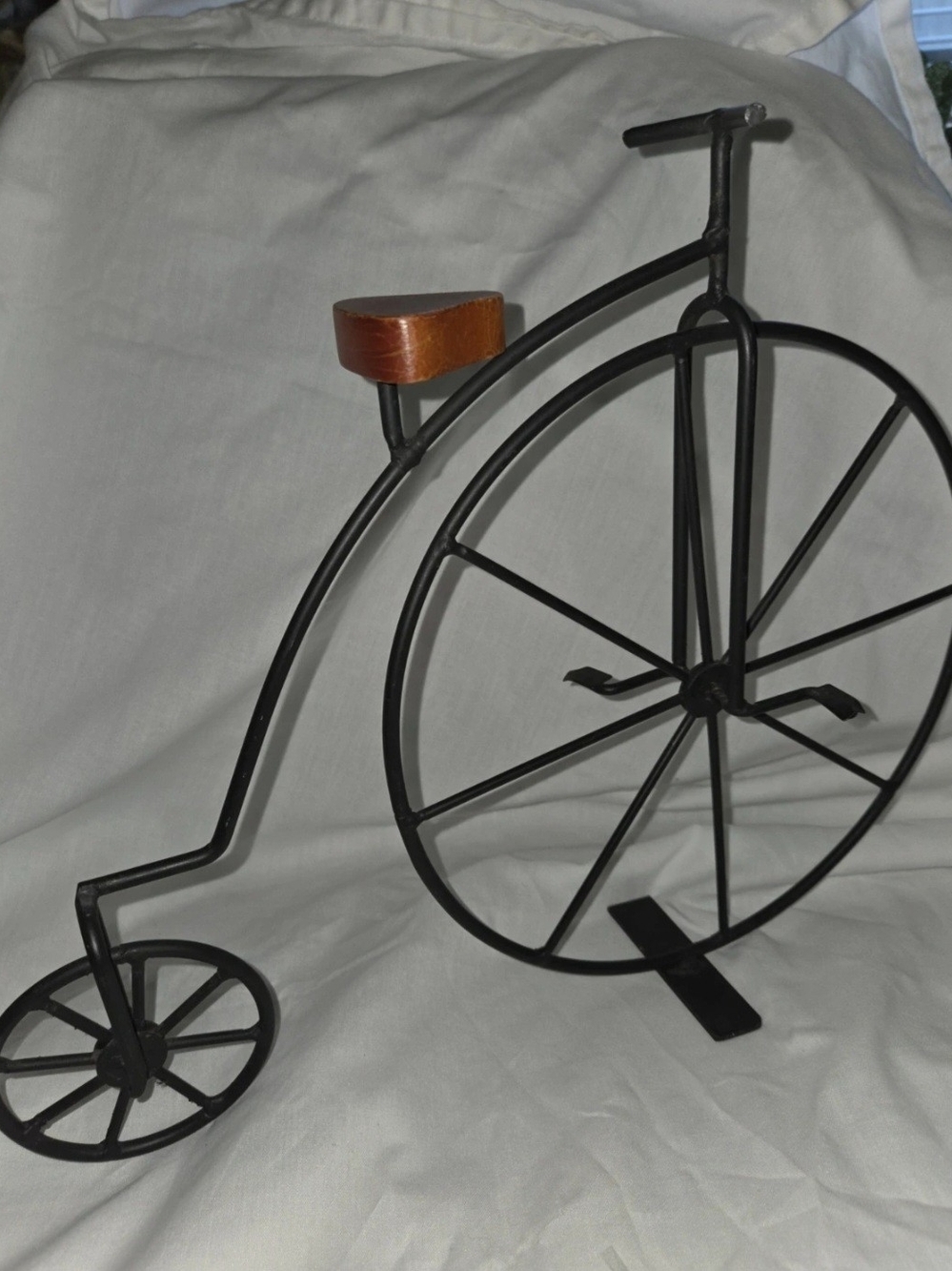 Black Metal Vintage Bicycle Sculpture with Brown Wood Seat Accent